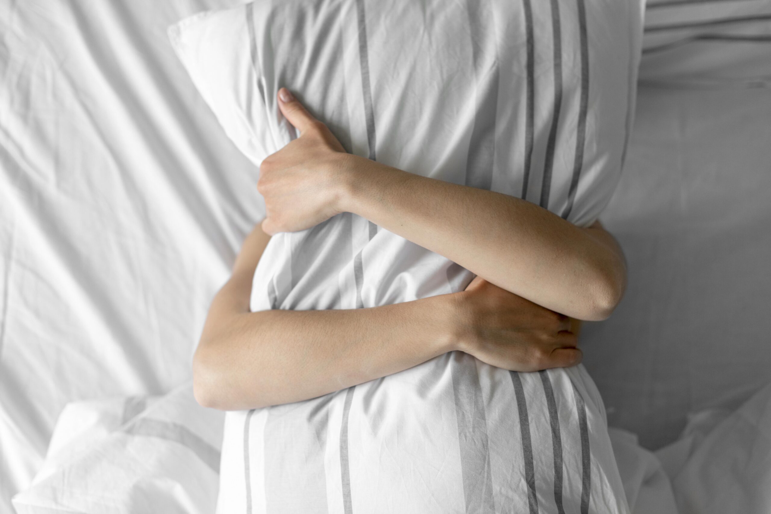 Man Embracing Pillow In Pleasure